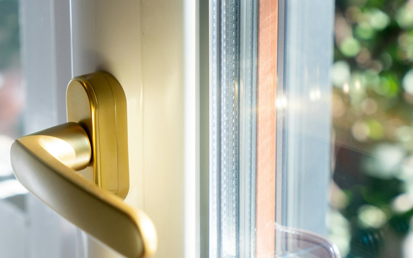 Close-up of a white uPVC window frame and handle